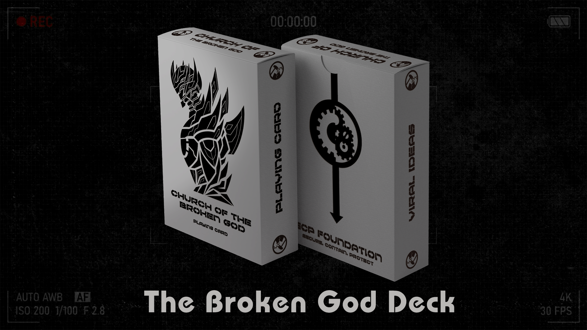 The image features the "Broken God Deck" playing cards from the SCP Foundation series. The playing cards are displayed in a tucked box, with a striking design on the front.