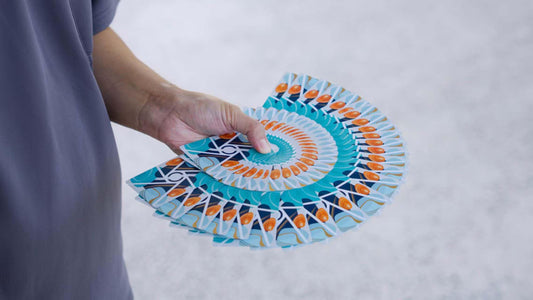Virtuoso Moments Nanjing Exclusive in full display in a vibrant teal, orange and navy blue giant fan.